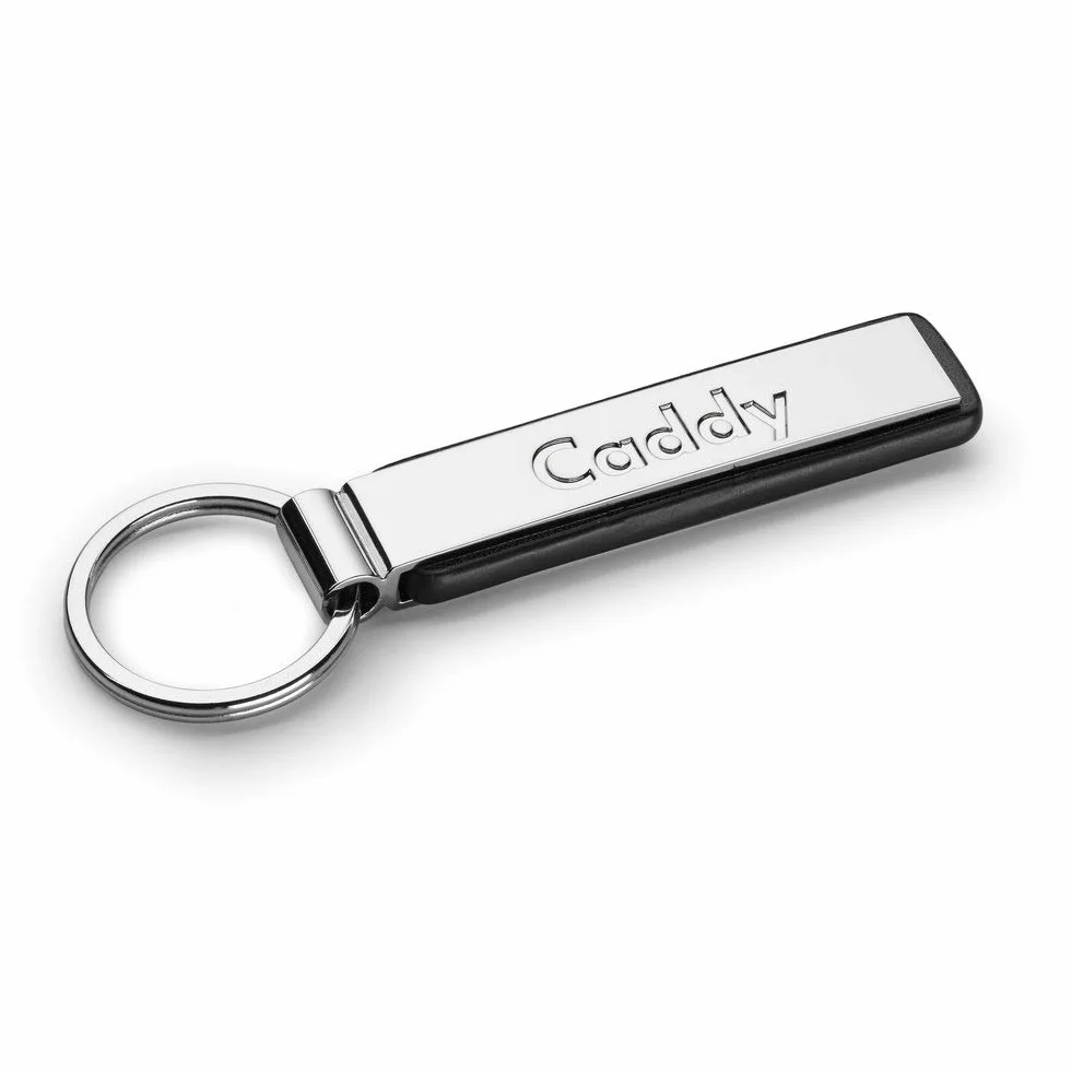 Volkswagen 000087010MYPN Breloczek do kluczy Caddy napis Keyring metal oryginalny wisiorek VW srebrny