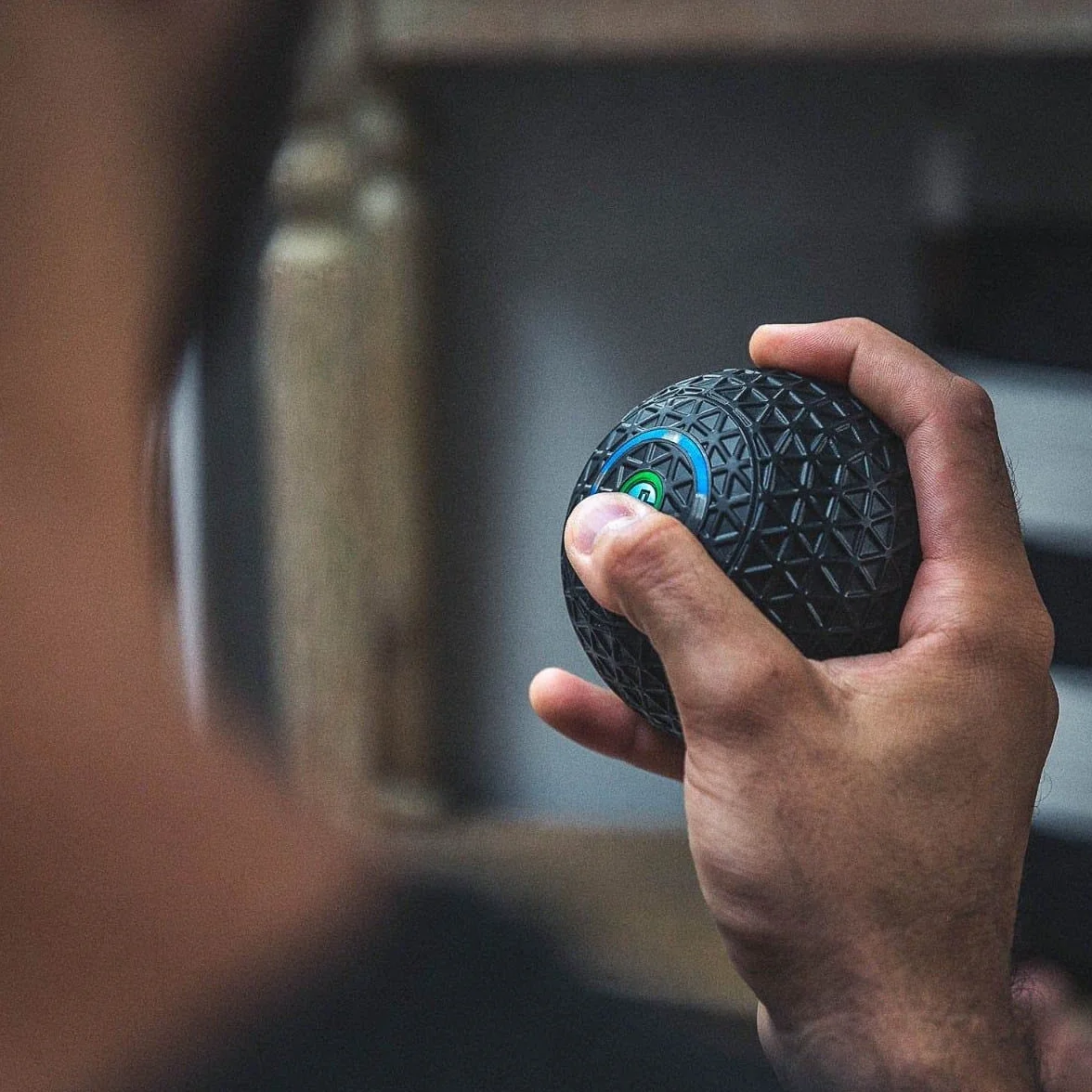 COMPEX Molecule Wibrująca piłka do masażu 4 prędkości wibracji ergonomiczna przenośna
